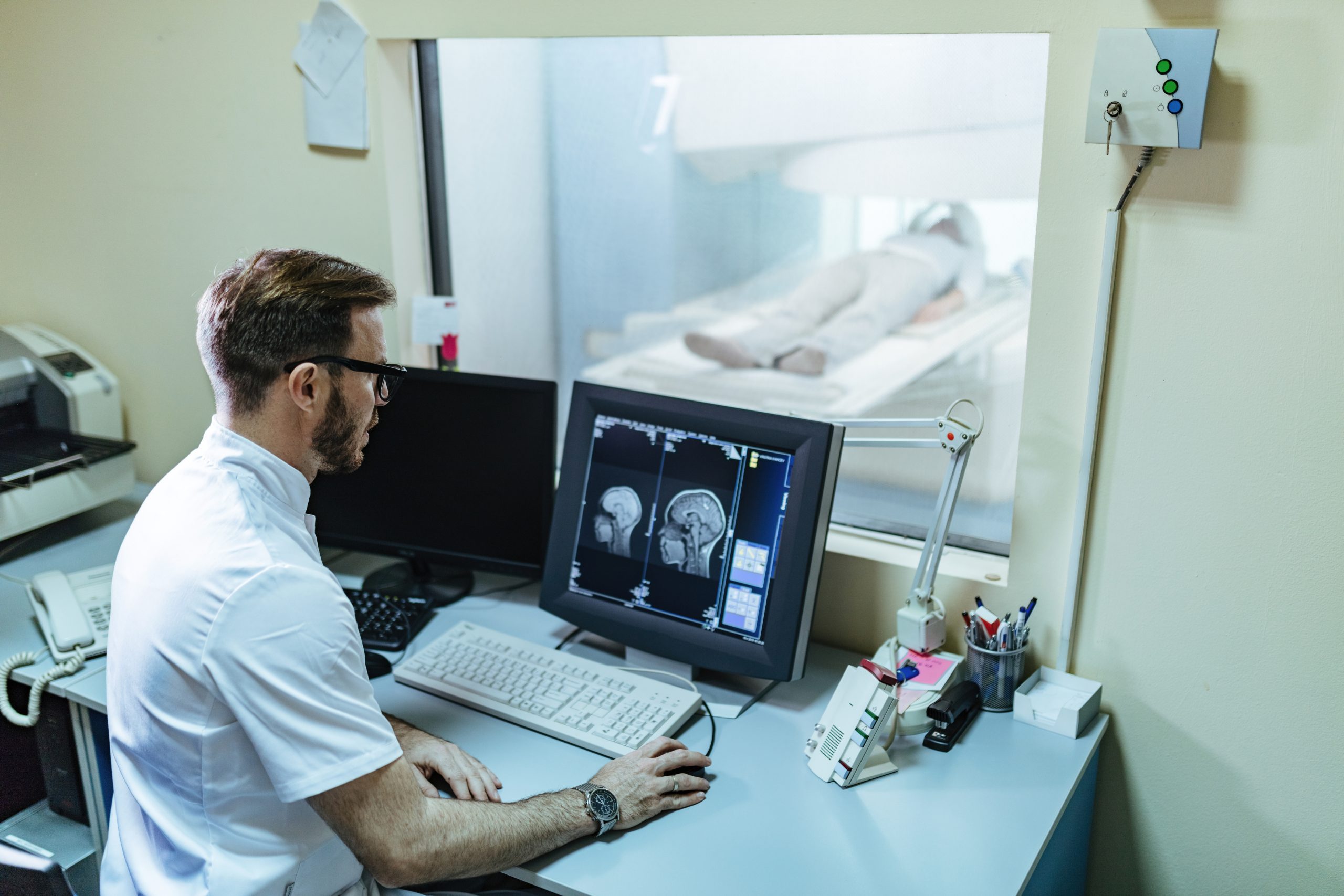 Doctor Reviewing Medical Imaging Scans for Diagnosis Tests